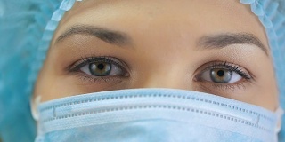 一个护士的眼睛在外科口罩
