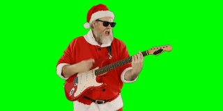 圣诞老人唱着歌，弹着吉他