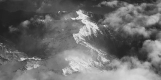 Vintage Black And White Aerial View of Clouds And Snow Covered Alps Mountains
