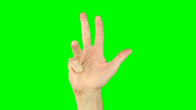 用手指从5数到1，从1数到5。绿色屏幕按键背景。男性的手势有数字到零。近距离的概念。手势数一，二，三，四，五，一，二，三，四，五。