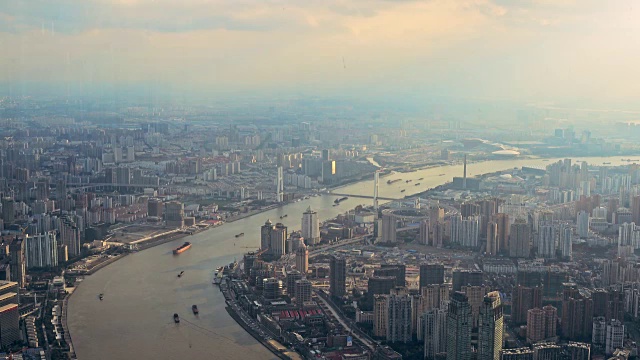 Huangpu bridge and Huangpu river in Shanghai Bund at sunset.