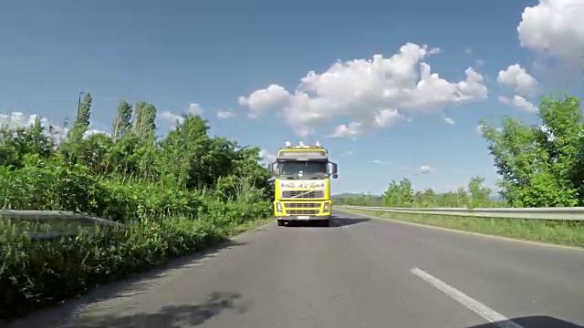 Overtaking truck on the road. Large delivery truck is moving