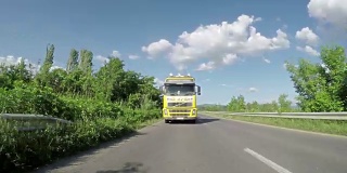 Overtaking truck on the road. Large delivery truck is moving