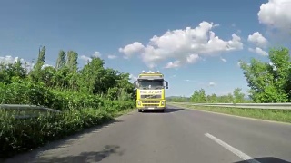 Overtaking truck on the road. Large delivery truck is moving视频素材模板下载
