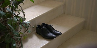 A Pair of Formal Men's Leather Shoes on a Stairs