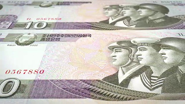 朝鲜10圆的钞票滚动，现金钞票，循环