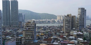 中国阳光日澳门城市景观公寓大楼屋顶海岸线全景4k