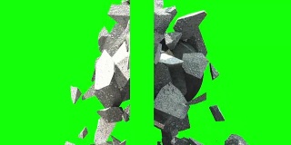 金属破碎球粉碎了墙。侧视图。绿色的屏幕。