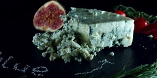 4K Close-up of Blue Cheese with Herbs and Figs