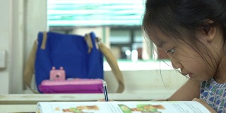 亚洲小女孩做作业，慢动作镜头