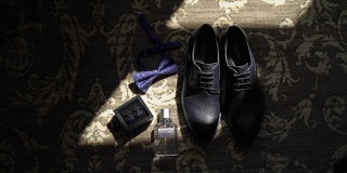 男士鞋，蝶形领结，袖扣和香水