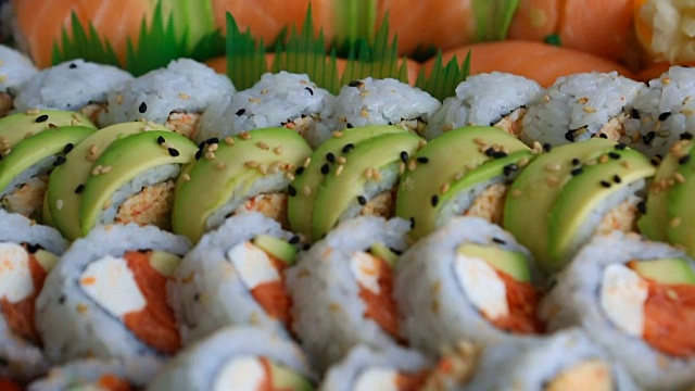 Video of fresh sushi rolls prepared with both raw and cooked ingredients 1080p