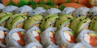 Video of fresh sushi rolls prepared with both raw and cooked ingredients 1080p