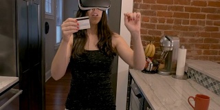一个女人在虚拟现实商店里用信用卡购物