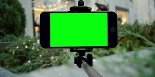智能手机绿色屏幕纽约市chromakey圣诞假期手机