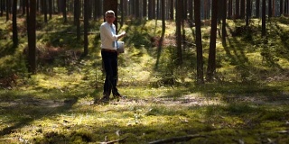 A lone businessman running in the woods