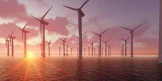 风力涡轮机发电机的轮廓在日落的海洋。
