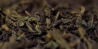 背景质感Sencha绿茶-清新，甘甜，茶香细腻。红茶特写背景。堆干红茶，质地。微距镜头