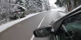 Car POV: on an Austrian mountain road in winter