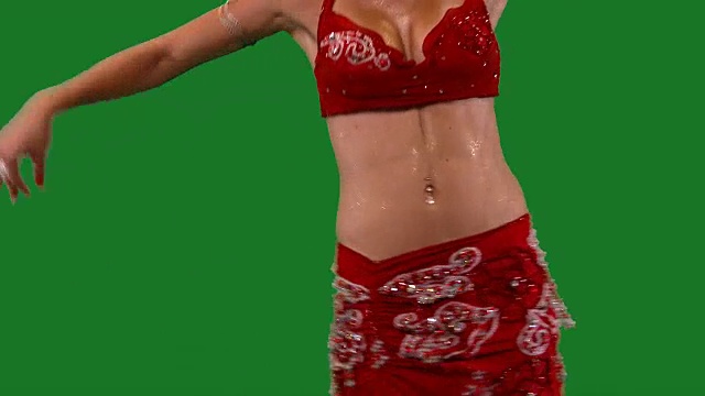 舞者。肚皮舞。肚皮舞者跳舞。绿色的屏幕。胸红性感CU