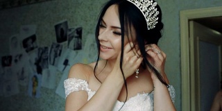 优雅的黑发新娘戴着漂亮的耳环