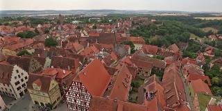 Film Tilt: aerial Pedestrian crowded Rothenburg ob der Tauber Bavaria, Germany