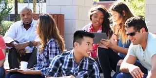A group of young adult college students on campus.