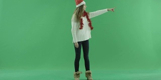 迷人的年轻女子在圣诞帽叫人来，色键的背景