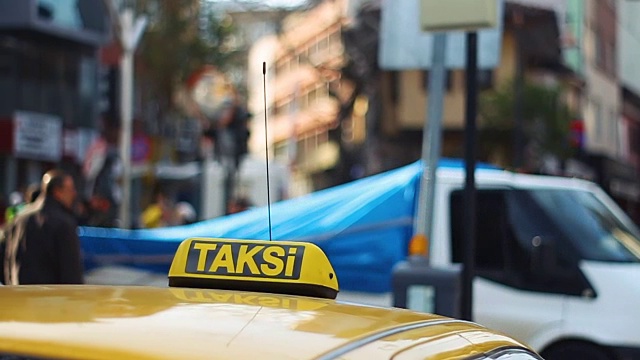 Istanbul Taxi cab with defocused people at the background