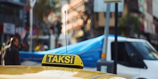 Istanbul Taxi cab with defocused people at the background