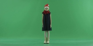 可爱的小女孩在圣诞帽，色度键背景