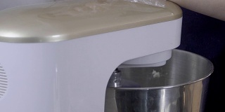 Close-up of process of kneading dough in the knead