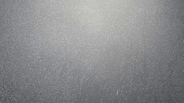 雨点落在玻璃灰色的背景上，水滴落在窗户上