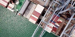 Top view of container ships and lifting cranes