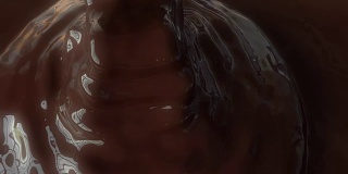 丝滑的巧克力糖浆被倒出来的漂亮特写。