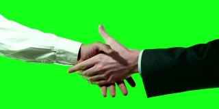 两名西装革履的商务人士在Chroma Key 4k视频上的国际握手。