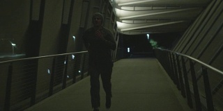Man Running at Night Alone in Dark City