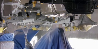 automatic process of covering bottoms of new car by anticorrosive compounds in production