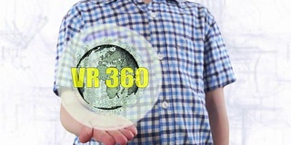 年轻人展示了地球的全息图和文本VR 360