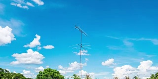 Time lapse video of Aerial television antenna with cloud moving and blue sky
