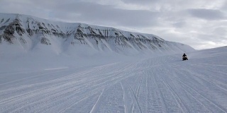 People expedition on snowmobile in North Pole Spitsbergen Svalbard Arctic.