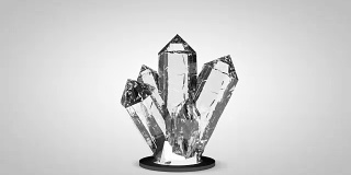 逼真的3D钻石水晶石头旋转在白色的背景。计算机渲染动画无缝循环。