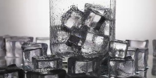 Ice cubes for drinks in a glass of water