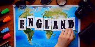 英国字字母题词木桌。地理的概念度假旅行旅行冒险