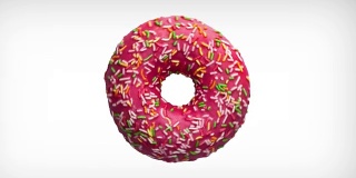 抽象旋转动画美味的甜甜圈与彩色的点缀在白色的背景。