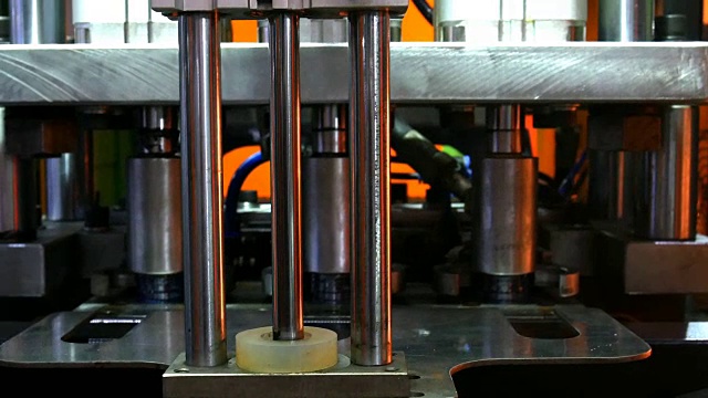 Plastic water bottles on a bottle machine and equipment in a factory
