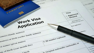 工作签证申请表及护照、笔视频素材模板下载
