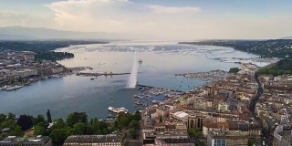 阳光明媚的一天，日内瓦湖湾著名的喷泉城市景观航拍全景4k时间流逝瑞士