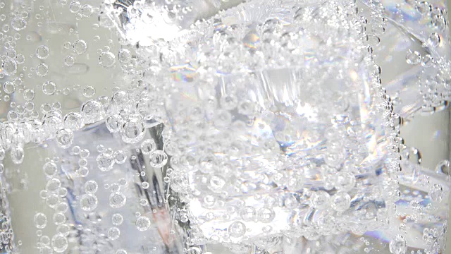 Close up bubbles of soda and ice background