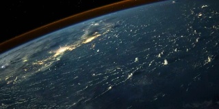 从太空看，云在地球上的水面和城市上投下长长的阴影。在背景中可以看到雷暴。图片由美国宇航局约翰逊航天中心地球科学和遥感单元提供。由Rebus_Prod处理。